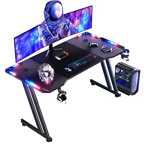 DLONGONE 120 x 60cm RGB Gaming Desk, Large Gaming Table for Laptop Home Office Desk Carbon Fiber Coated Gaming PC Desk with Headphone Hook and Cup Holder, Easy to Assemble, Black